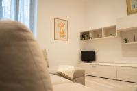 Televízia a/alebo spoločenská miestnosť v ubytovaní Casa Donna Lidia