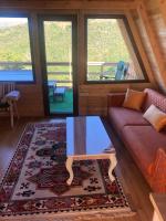 a living room with a couch and a table at Villa Kalaja in Novoberdo