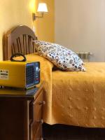 A bed or beds in a room at Hostal Edreira