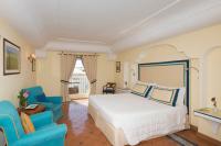 Posteľ alebo postele v izbe v ubytovaní Hotel Punta Regina