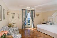 Posteľ alebo postele v izbe v ubytovaní Hotel Punta Regina