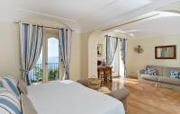 Posteľ alebo postele v izbe v ubytovaní Hotel Punta Regina