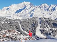 a mountain with a town in the snow with a red arrow at APPARTEMENT PLEIN SUD AUX SAISIES N°6 in Les Saisies