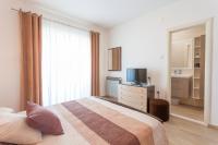 Posteľ alebo postele v izbe v ubytovaní Apartments & Rooms Alagić