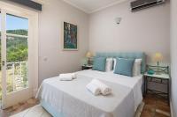 Posteľ alebo postele v izbe v ubytovaní Kalami Beach - Villa Almyra