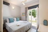 Posteľ alebo postele v izbe v ubytovaní Kalami Beach - Villa Almyra