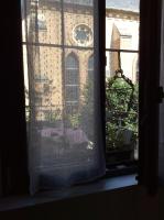 a window with a view of a brick building at Les terrasses de l’orchestre in Amiens