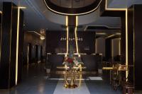 a restaurant with a table and chairs in a room at ALJAWHARA ALZARQAA FOR SERVISED APARTMENTS Est 2 in Rabigh
