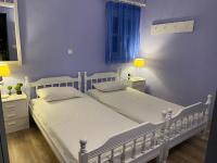 Postel nebo postele na pokoji v ubytování Thodoris Infinity View Apartments