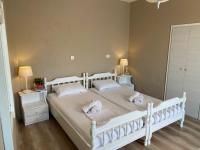 Postel nebo postele na pokoji v ubytování Thodoris Infinity View Apartments