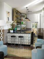 a bar in a restaurant with blue bar stools at Hotel Victor South Beach in Miami Beach