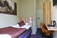 Hotel Asterisk, a family run hotelにあるベッド