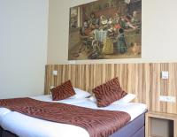 Hotel Asterisk, a family run hotelにあるベッド
