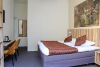 Hotel Asterisk, a family run hotelにあるベッド