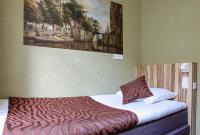 Hotel Asterisk, a family run hotelにあるベッド