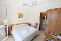 Postel nebo postele na pokoji v ubytování Hotel Villa Wanda