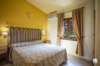 Postel nebo postele na pokoji v ubytování Tonicello Hotel Resort & SPA