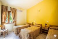 Postel nebo postele na pokoji v ubytování Tonicello Hotel Resort & SPA