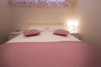 Posteľ alebo postele v izbe v ubytovaní Apartment Fragola