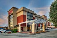 a hotel with cars parked in a parking lot at Drury Inn &amp; Suites Bowling Green in Bowling Green