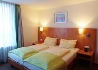 Postel nebo postele na pokoji v ubytování Hotel Mingarden