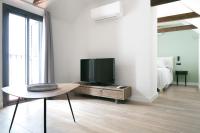 Televízia a/alebo spoločenská miestnosť v ubytovaní Aqua Apartments Málaga