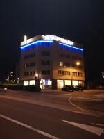 a building with blue lights on top of it at Contact Hôtel Foch in Besançon