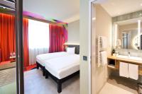 Posteľ alebo postele v izbe v ubytovaní ibis Styles Parndorf Neusiedler See