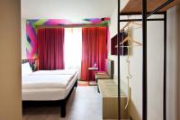 Posteľ alebo postele v izbe v ubytovaní ibis Styles Parndorf Neusiedler See