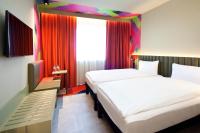 Posteľ alebo postele v izbe v ubytovaní ibis Styles Parndorf Neusiedler See
