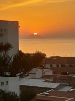 The sunrise or sunset as seen from a vendégházakat or nearby