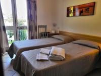 Postel nebo postele na pokoji v ubytování Hotel Villa Wanda
