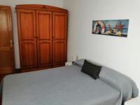 Postel nebo postele na pokoji v ubytování Apartamentos Flor del Cotillo