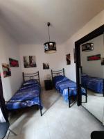 Postel nebo postele na pokoji v ubytování La casa di Carmen