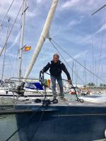 a man standing on the bow of a sail boat at VOILIER ESTEREL in La Rochelle