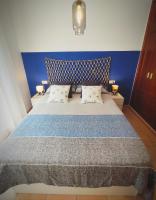 Posteľ alebo postele v izbe v ubytovaní El ático de los flamencos, Apartamentos Living Sur