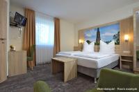 Ein Bett oder Betten in einem Zimmer der Unterkunft DORMERO Moselhotel Koblenz-Alken