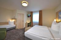 Ein Bett oder Betten in einem Zimmer der Unterkunft DORMERO Moselhotel Koblenz-Alken