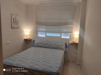 Posteľ alebo postele v izbe v ubytovaní APARTAMENTO CON TERRAZA, VISTAS AL MAR Y PISCINA