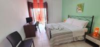 A bed or beds in a room at Costa Gaia Rooms
