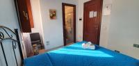 A bed or beds in a room at Costa Gaia Rooms
