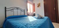 A bed or beds in a room at Costa Gaia Rooms