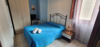 A bed or beds in a room at Costa Gaia Rooms