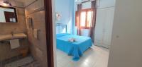 A bed or beds in a room at Costa Gaia Rooms
