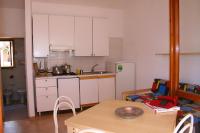A kitchen or kitchenette at Verdemare Sardegna Due Villette