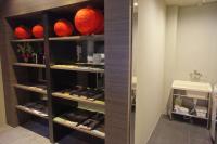 a walk in closet with red balls on shelves at Main Inn Taipei in Taipei