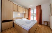 Posteľ alebo postele v izbe v ubytovaní Apartments Stanicic Kampor