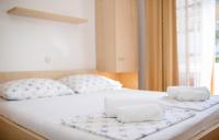 Posteľ alebo postele v izbe v ubytovaní Apartments Stanicic Kampor