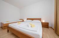 Posteľ alebo postele v izbe v ubytovaní Apartments Stanicic Kampor