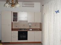 Kuchyň nebo kuchyňský kout v ubytování Apartments Ariana